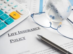 Calculator and Life Insurance Policy