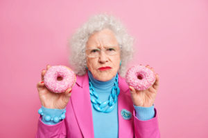 Elderly Woman with Donuts